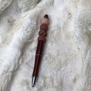 Handcrafted beaded. Brown/tan/animal print. Made with bpa free silicone.